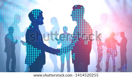 Silhouettes of business people shaking hands and discussing work over blurred background with double exposure of world map. Concept of international company and hi tech. Toned image