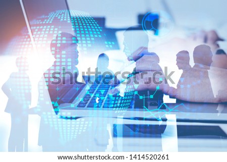 Hands of woman typing on laptop with double exposure of business people and business infographics. Concept of hi tech and planning. Toned image
