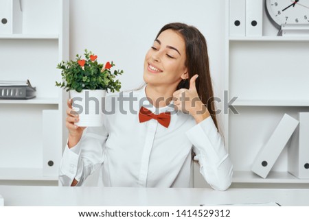 Business woman flower in potty bow tie racks             