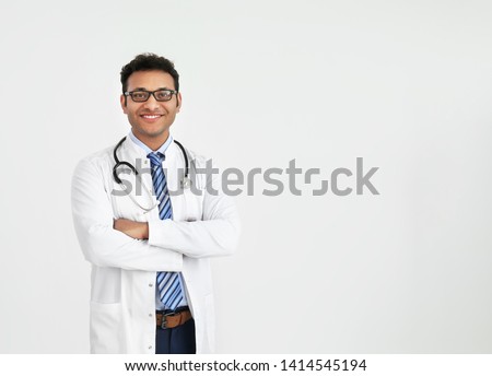 Handsome male doctor on white background Royalty-Free Stock Photo #1414545194