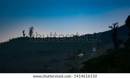 Blurred dark hills and sky after raining in nature
