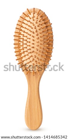 Wooden massage hairbrush isolated on white background. Clipping Path. Full depth of field. Royalty-Free Stock Photo #1414685342