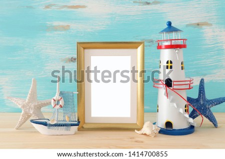 Nautical concept with sea life style objects on wooden table. For photography montage