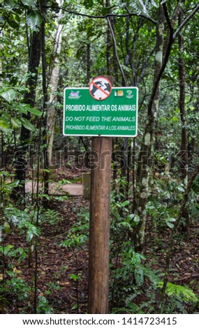 Iguaçu Park Signage Board written in two languages, Portuguese and English. Foz do Iguaçu, Brazil