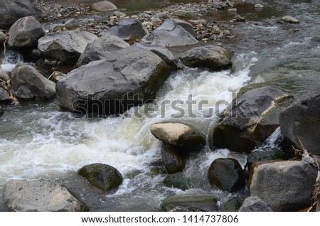 Water flow and stones on the river