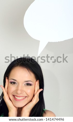 Thought girl in bubble next to it on grey background
