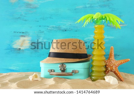 nautical, vacation and travel image with sea life style objects in the beach sand