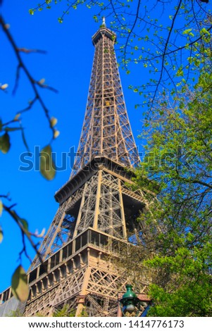 A beautiful scenery of Eiffel Tower under clear blue sky.