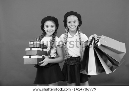 Birthday present. Shopping and holidays. For my dear friend. Girl giving gift box to friend. Girls friends celebrate holiday. Children formal wear with gift box. Open gift now. Friendship concept.