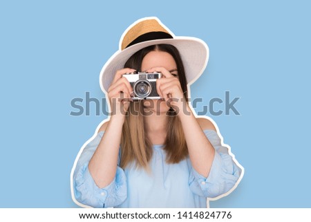 Funny cool girl with retro camera wearing hat, blue dress over blue background. Cartoon social network stickers.
