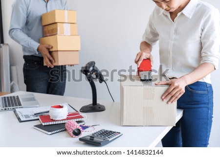 Shipment Online Sales, Small business or SME entrepreneur owner delivery service and working packing box, business owner working checking order to confirm before sending customer in post office.