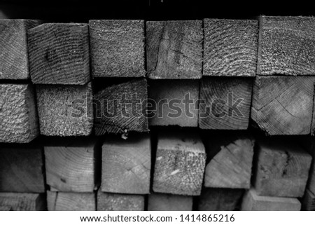 wood lumbers square front views texture stockpiled in warehouse