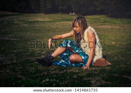 A Young Beautiful Girl Outdoors with Spring Nature Background