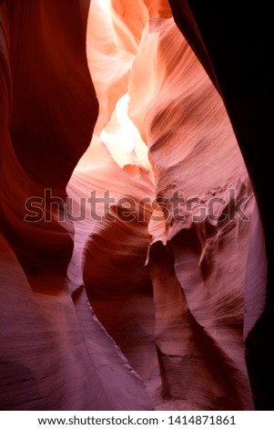 Antelope Canyon. The light enter into the narrow canyon walls creating beautiful colours in the sandstone rock. Lower Antelope Canyon,  Navajo Nation, Arizona, USA.