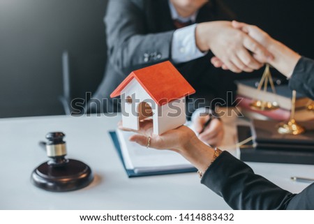 Lawyer who provides legal advice in the office. Trading house legally.