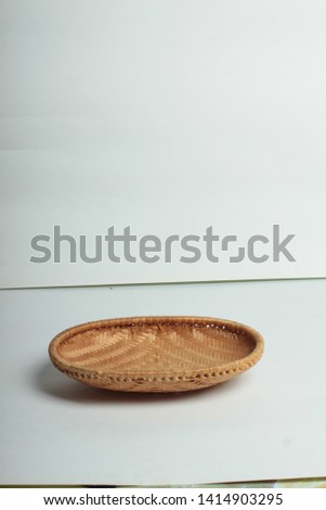 brown wicker basket on white background