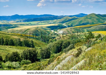Beautiful panoramic aerial summer view at sunset to the Bukhtarma mountains in the valley of the river Irtysh, eastern Kazakhstan