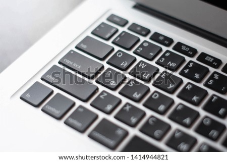 A large photo of a black keyboard from a laptop for business