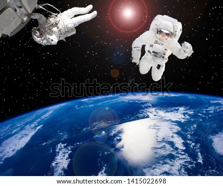 Astronaut above the earth globe. Space picture. The elements of this image furnished by NASA.
