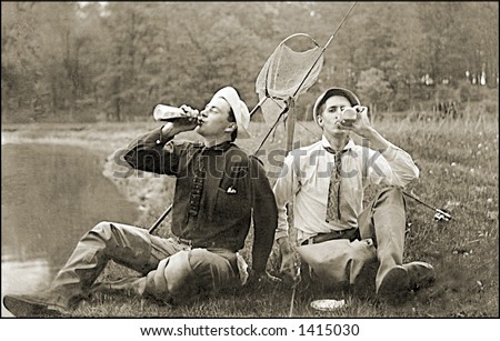 Vintage photo of Two Fishermen On Shore Drinking