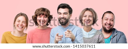 Men and women laughing on joke having good mood.