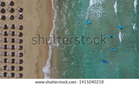 Aerial drone photo of paradise organised with sun beds and umbrellas sandy deep turquoise beach of Falassarna in North West Crete island, Greece