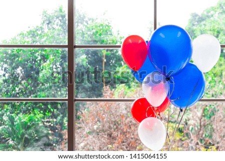 White, red and blue balloons with the outside scene background - independence day concept.