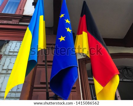 The national flags of Ukraine, Germany and EU.