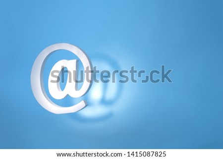 floating email sign on blue background with real shadow. Concept for email, communication or contact us
