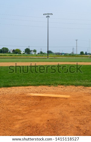 Youth baseball pitching mound on a beautiful Spring day.  LaSalle, Illinois, USA