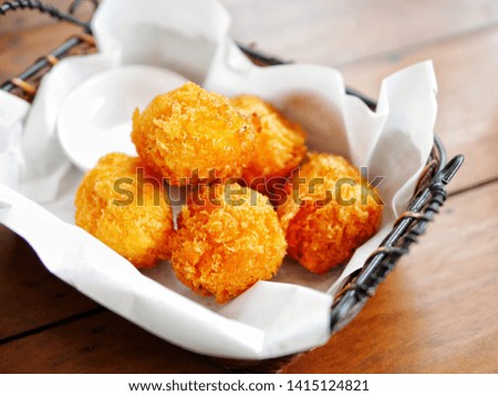 Chicken cheese ball in rattan basket, selective focus