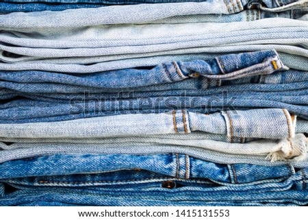 denim blue jeans stack texture background closeup