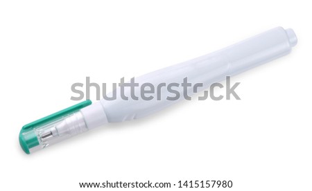 Green pen corrector on a white background