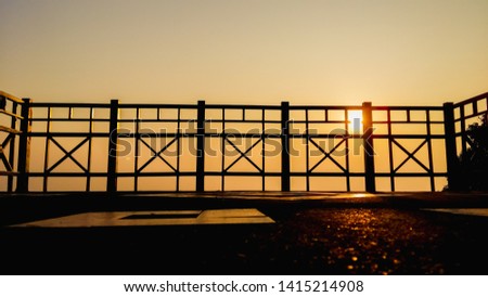 Shadow image,The steel fence was made on the balcony to prevent the danger of falling from a high position, a sturdy steel fence on the background of the twilight sky in the morning.