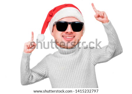Dancer man Santa's caricature with big head and red cap on white background isolate. Happy funny big head portrait of guy celebration Christmas. Adult boy rejoices to a holiday at a party