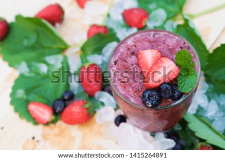 top view mixed berries soda on wooden background. summer drink