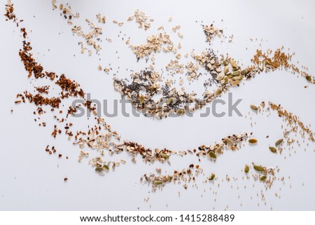 Grain of various types scattered on a white surface. Background.