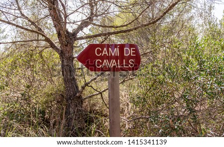 A path sign on the Cami de Cavalls (horse walk) coastal walk in Minorca island.