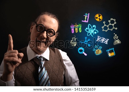Funny scientist looking to chemistry symbols chemical