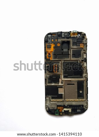 disassemble smartphone board for repair isolated on white background with space for text. Screen folder with electronic connector jacks. Heat dispatching plate or antenna area on back of screen. 