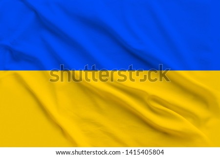 Beautiful silk flag of Ukraine with soft folds in the wind.