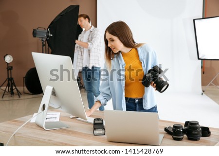 Professional photographer in modern studio