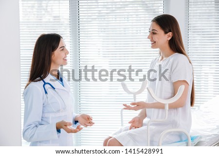 Female gynecologist working with patient in clinic Royalty-Free Stock Photo #1415428991