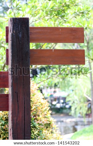 Wooden labels in a park and wooden on Brown Color.