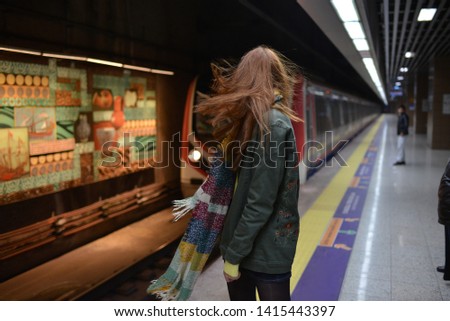 portrait of girl at the metro station
