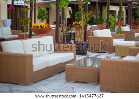 summer outdoor seating area with white sofas