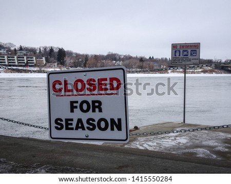 Warning sign in winter, South Saskatchewan River, Saskatoon, Canada