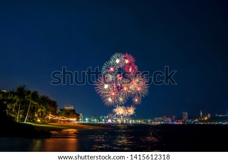 Cityscape of Pattaya in night with Fireworks