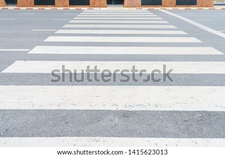 crosswalk on the road for safety when people walking cross the street, Crosswalk on the street for safety.
