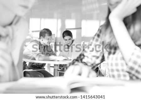 Black and White photo of Students learning at library in university